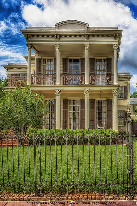 Front view of the historic D’Arcy-Manning House at 1420 First Street in New Orleans, a Greek Revival home with tall columns, iron balcony, and shutters — longtime residence of Saints quarterback Archie Manning and his family.